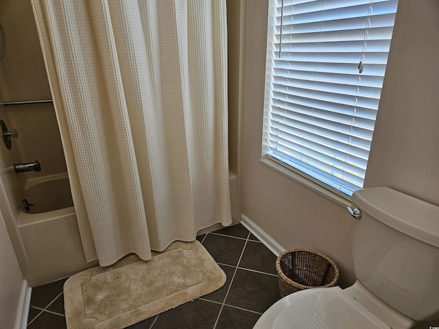 bathroom with tile patterned floors and shower / tub combo with curtain