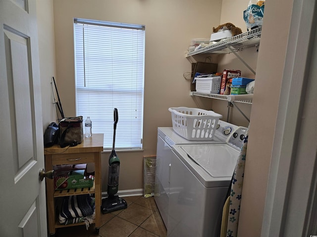 laundry area featuring washer and dryer and tile patterned flooring