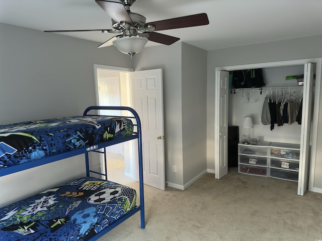 bedroom with carpet floors, a closet, and ceiling fan