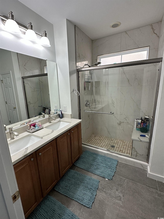 bathroom featuring vanity and an enclosed shower