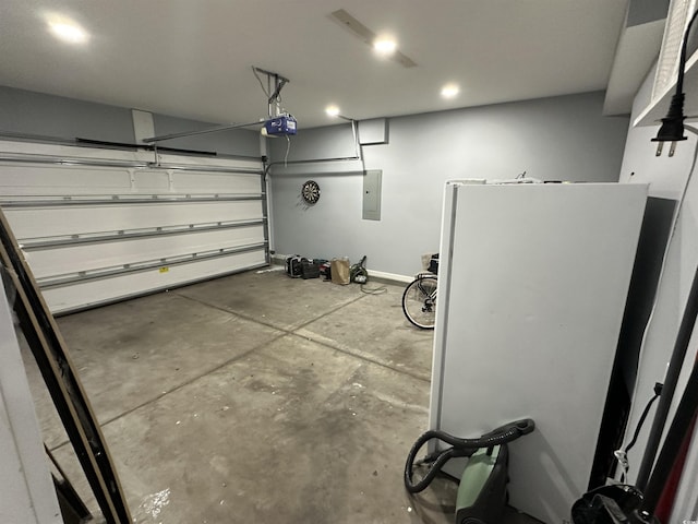 garage featuring electric panel and a garage door opener