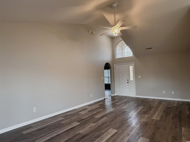 interior space with dark hardwood / wood-style floors, ceiling fan, and high vaulted ceiling