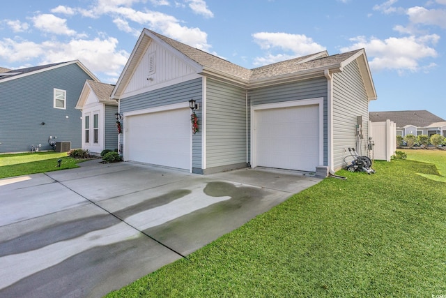 5037 Sassari St, Myrtle Beach, SC 29579 - view of side of property with concrete driveway, a yard, an attached garage, and board and batten siding