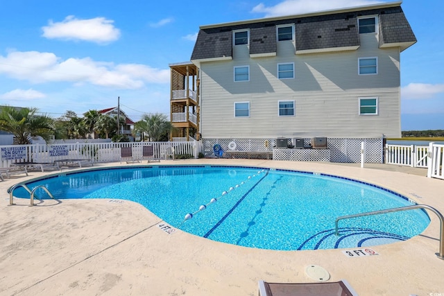 view of pool featuring a patio