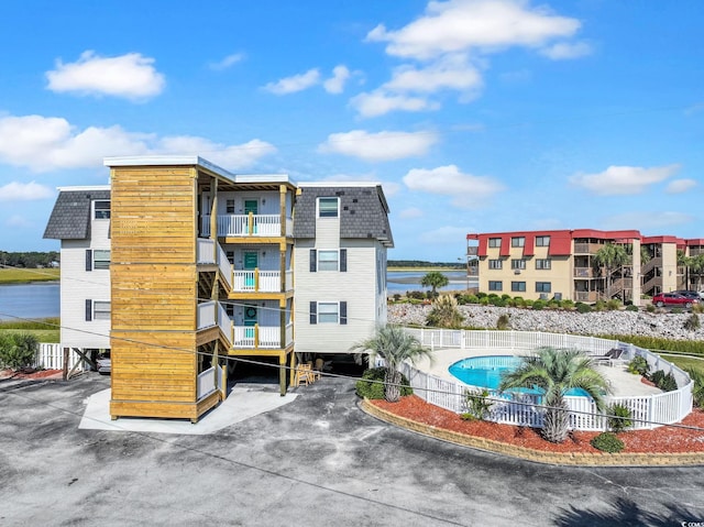 view of building exterior featuring a water view