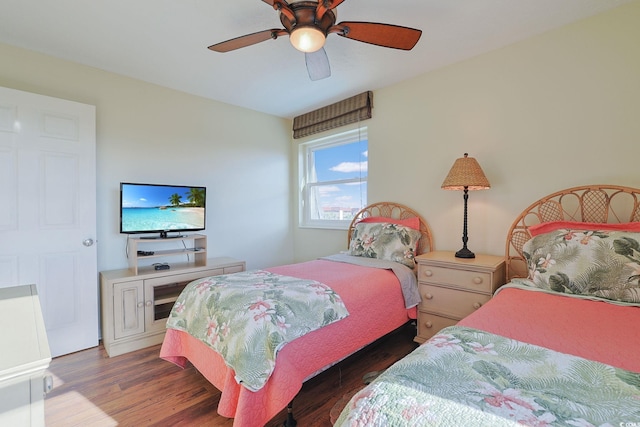 bedroom with ceiling fan and dark wood-type flooring