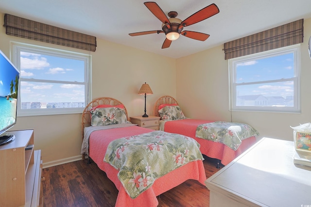 bedroom featuring ceiling fan and dark wood-type flooring