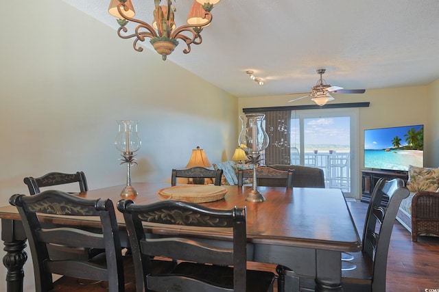 dining room with a textured ceiling, dark hardwood / wood-style flooring, and ceiling fan with notable chandelier