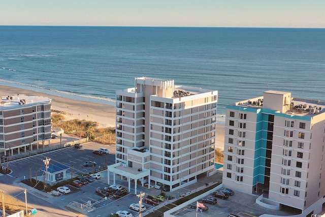 bird's eye view featuring a view of the beach and a water view