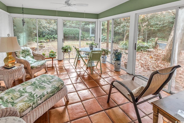 sunroom featuring ceiling fan