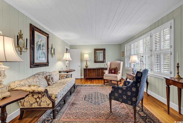 living room with hardwood / wood-style floors, wooden ceiling, and crown molding