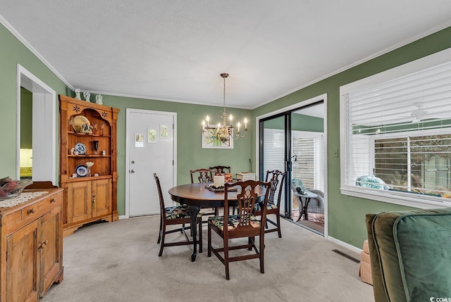 carpeted dining room with a notable chandelier and crown molding