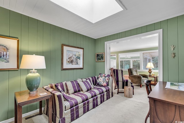 living room with wood walls and carpet floors