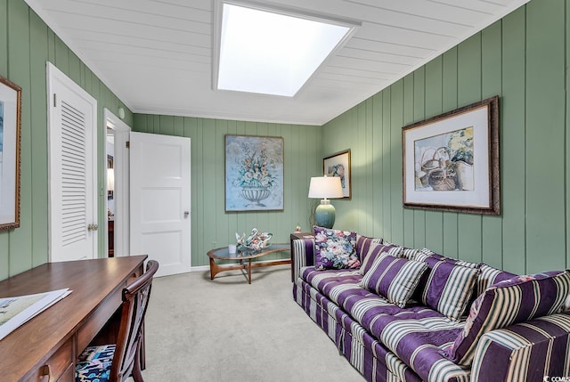 carpeted living room with wooden walls