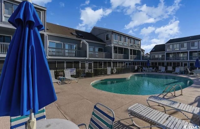 view of swimming pool featuring a patio area