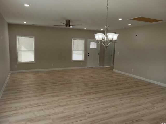 unfurnished room featuring recessed lighting, plenty of natural light, and light wood finished floors