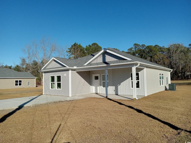 view of front of property with cooling unit and a porch