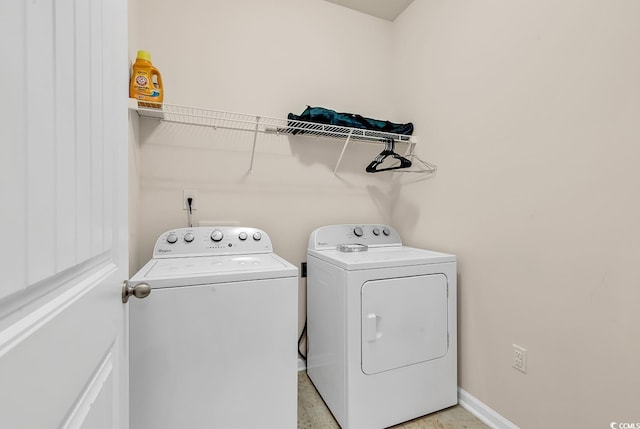 clothes washing area featuring washing machine and dryer