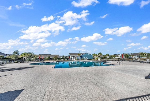 view of swimming pool with a patio area