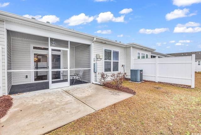 back of house with central AC, a patio area, and a sunroom