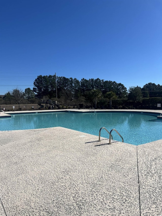 view of swimming pool featuring a patio