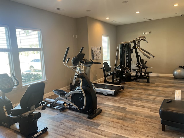 gym with hardwood / wood-style flooring