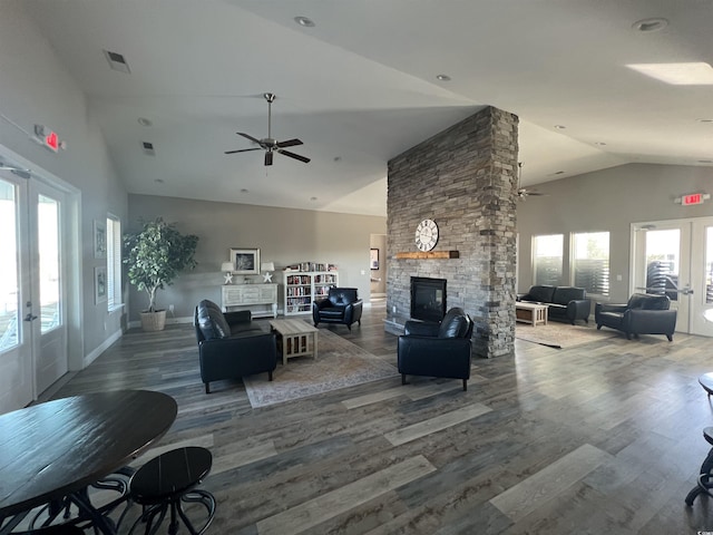 living room featuring dark wood-type flooring, a fireplace, french doors, and ceiling fan