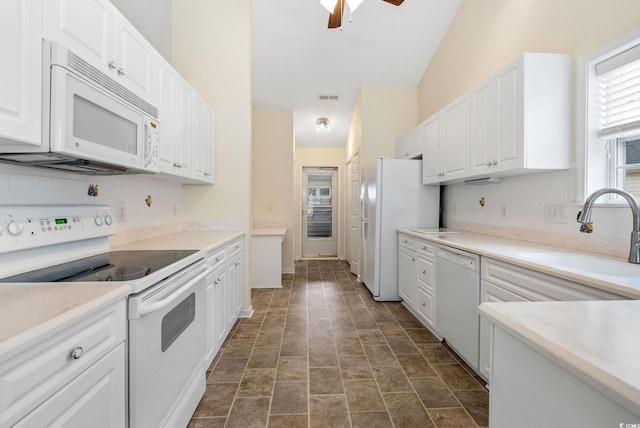 kitchen featuring white cabinets, white appliances, ceiling fan, and sink