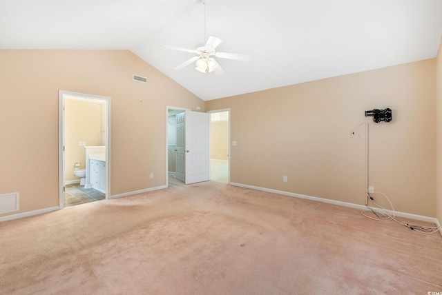 unfurnished bedroom featuring ceiling fan, light colored carpet, connected bathroom, and a closet