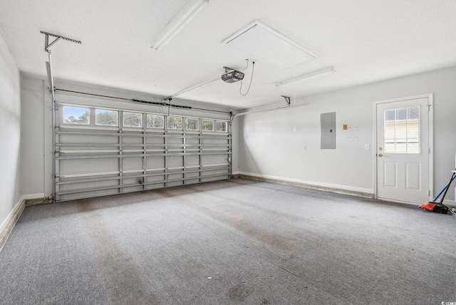 garage with electric panel and a garage door opener