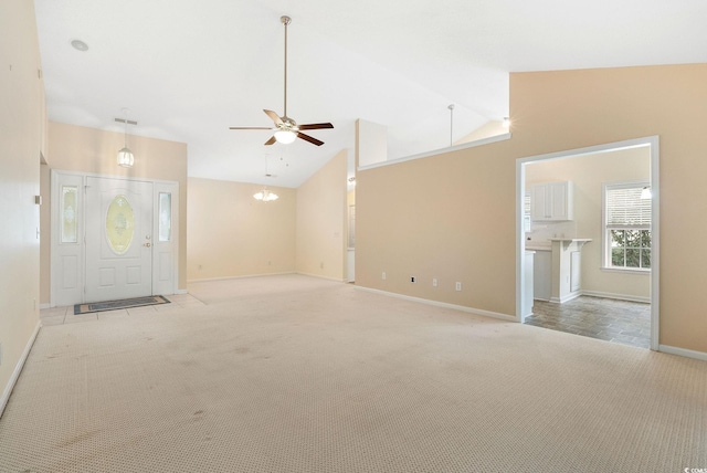 unfurnished living room with ceiling fan, light carpet, and vaulted ceiling