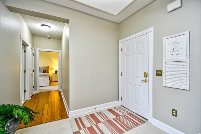 entrance foyer with a textured ceiling