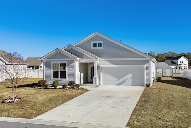 view of front of house featuring a front lawn and a garage