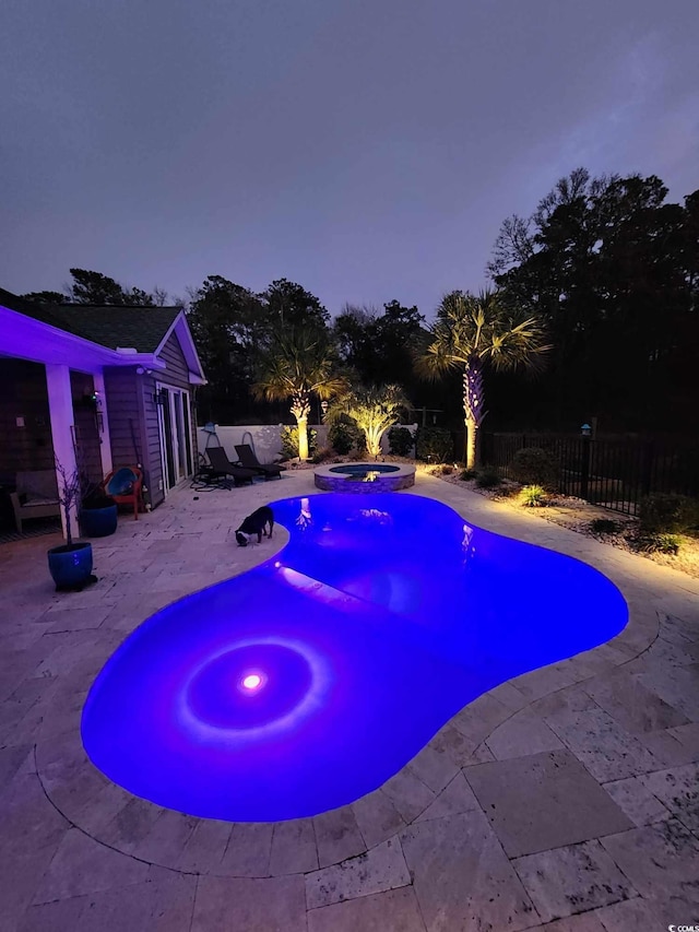 view of pool with a fenced in pool, a patio area, fence, and an in ground hot tub