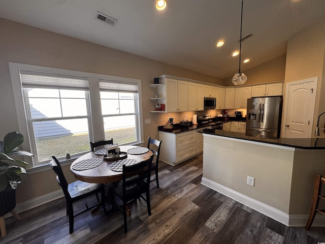 kitchen with decorative light fixtures, open shelves, stainless steel appliances, dark countertops, and white cabinetry