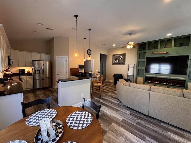 dining room with built in shelves, recessed lighting, visible vents, dark wood-type flooring, and a ceiling fan