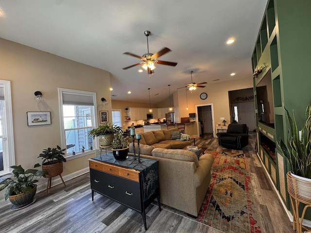 living room with lofted ceiling, dark wood-style floors, and recessed lighting