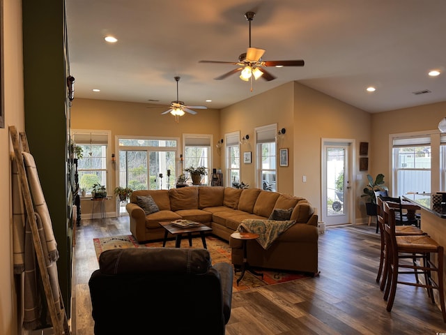 living room featuring dark wood-style floors, recessed lighting, visible vents, and baseboards