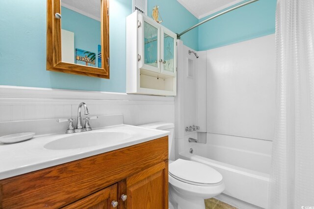 full bathroom with shower / bath combo, toilet, a textured ceiling, and vanity