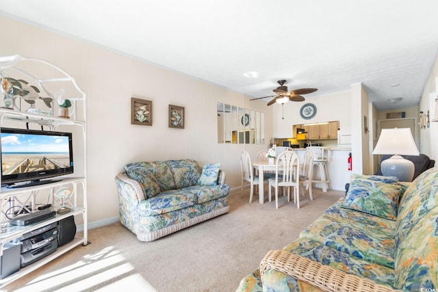 carpeted living room featuring ceiling fan