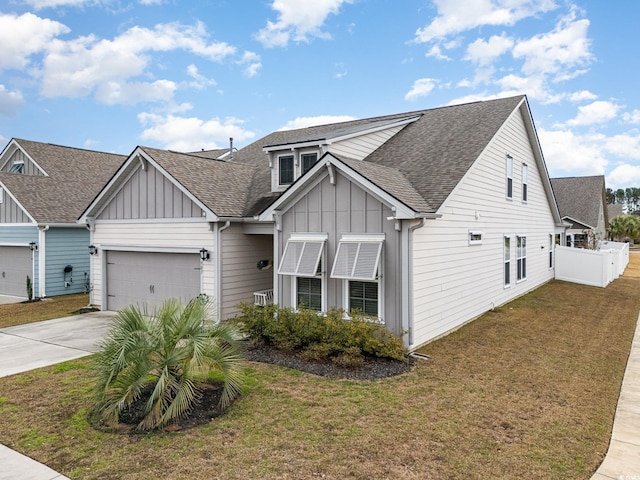 view of front of house featuring a front yard and a garage