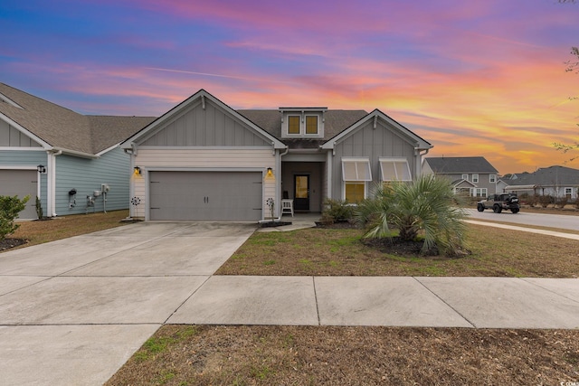 view of front of property featuring a yard and a garage