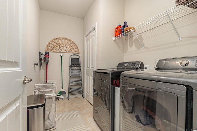 laundry room with separate washer and dryer