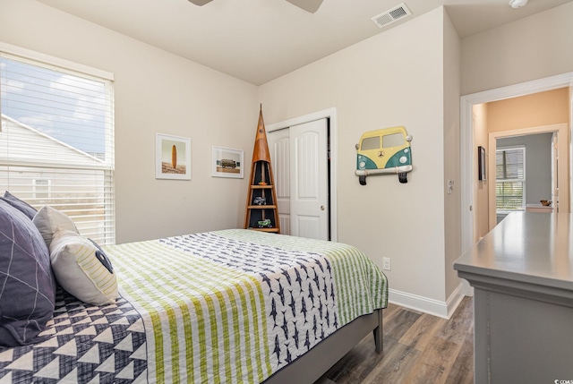 bedroom featuring wood-type flooring, a closet, and ceiling fan