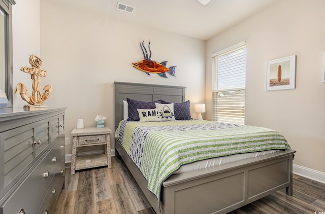 bedroom featuring dark wood-type flooring