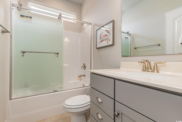 full bathroom with tile patterned floors, toilet, combined bath / shower with glass door, and vanity