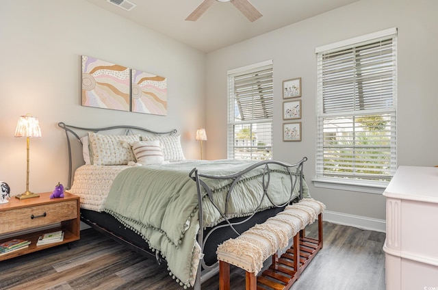 bedroom with ceiling fan and dark wood-type flooring