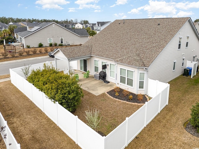 view of front of home with a patio area and a front lawn