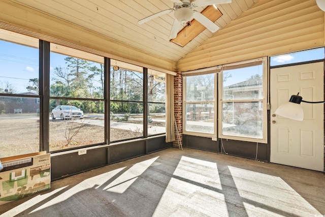 unfurnished sunroom featuring ceiling fan, wood ceiling, and lofted ceiling