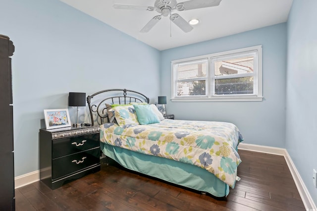 bedroom with ceiling fan and dark wood-type flooring